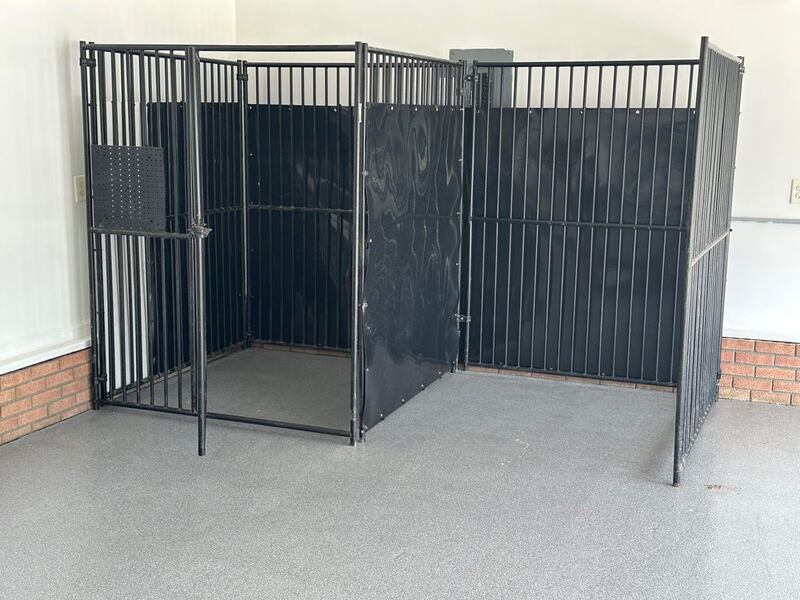 HDPE dog kennel panels installed on a kennel in a garage
