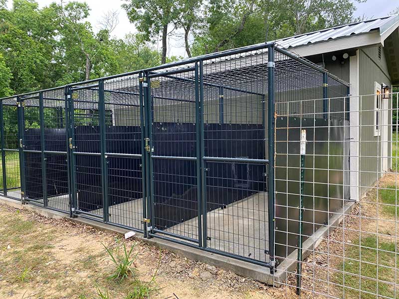 Waterproof kennel liner installed in an outdoor dog kennel